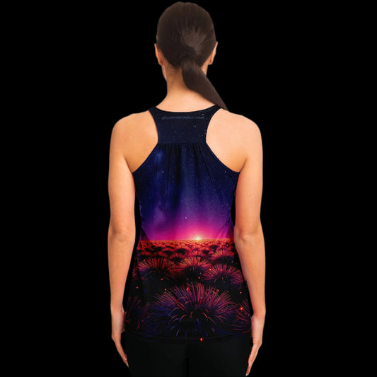 Woman wearing a tank top with a colorful sunset design on a white background